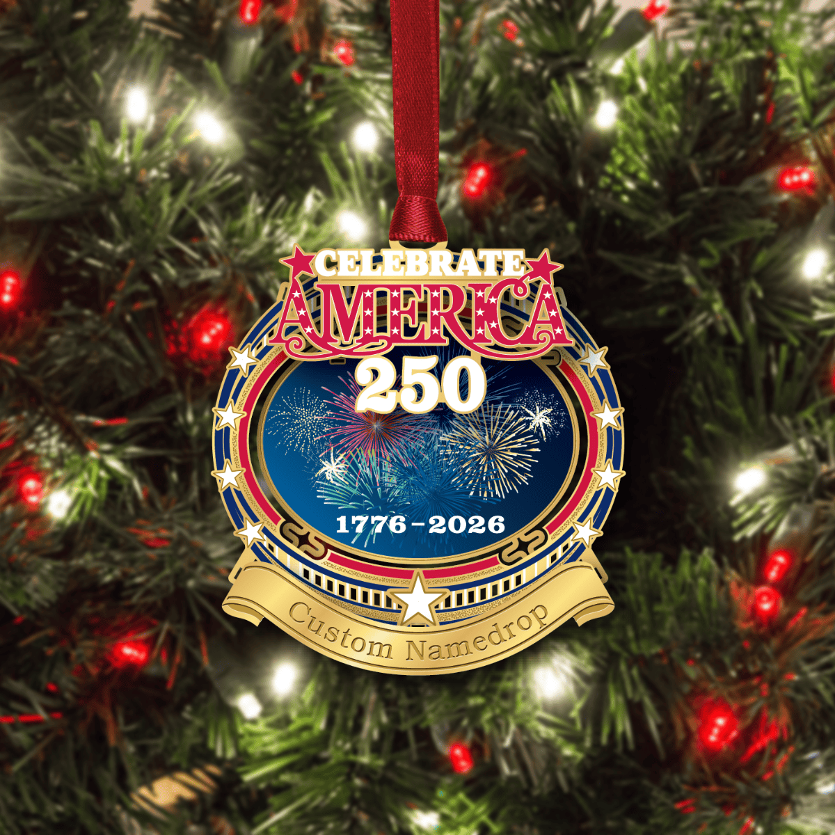 Custom namedrop ornament featuring “Celebrate America 250” with patriotic fireworks, gold stars, and the years 1776–2026, displayed on a decorated Christmas tree