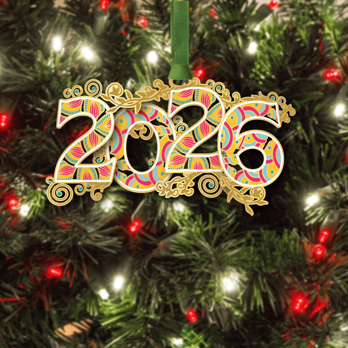 Ornament featuring the year “2026” in colorful patterned numerals with decorative gold scrollwork, displayed on a decorated Christmas tree