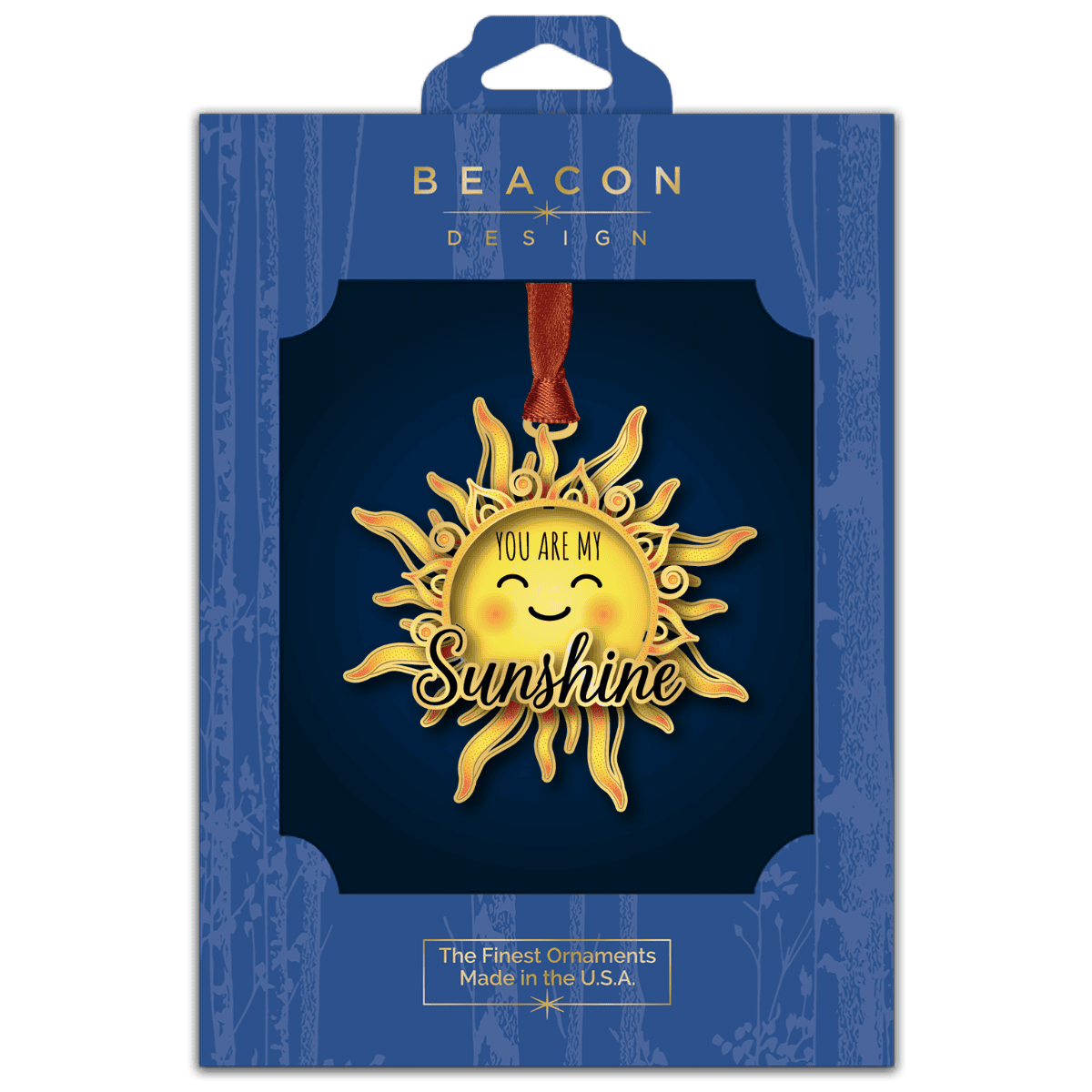 Ornament featuring a smiling sun with decorative rays and the message “You Are My Sunshine,” displayed on a decorated Christmas tree