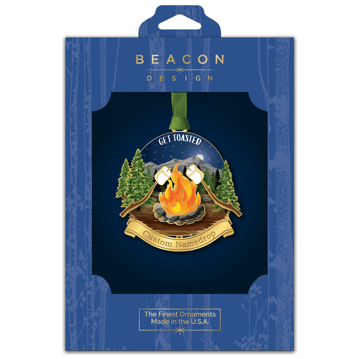 Custom ornament featuring a campfire with roasting marshmallows, pine trees, mountains, and the phrase “Get Toasted,” displayed in Beacon Design retail packaging