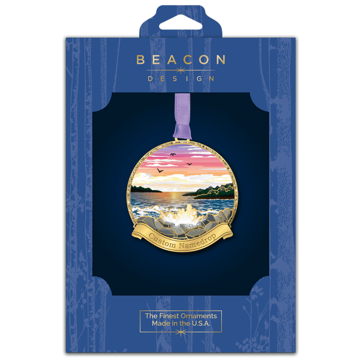 Custom ornament featuring a coastal sunset with ocean waves crashing against a rocky shoreline and distant islands, displayed in Beacon Design retail packaging