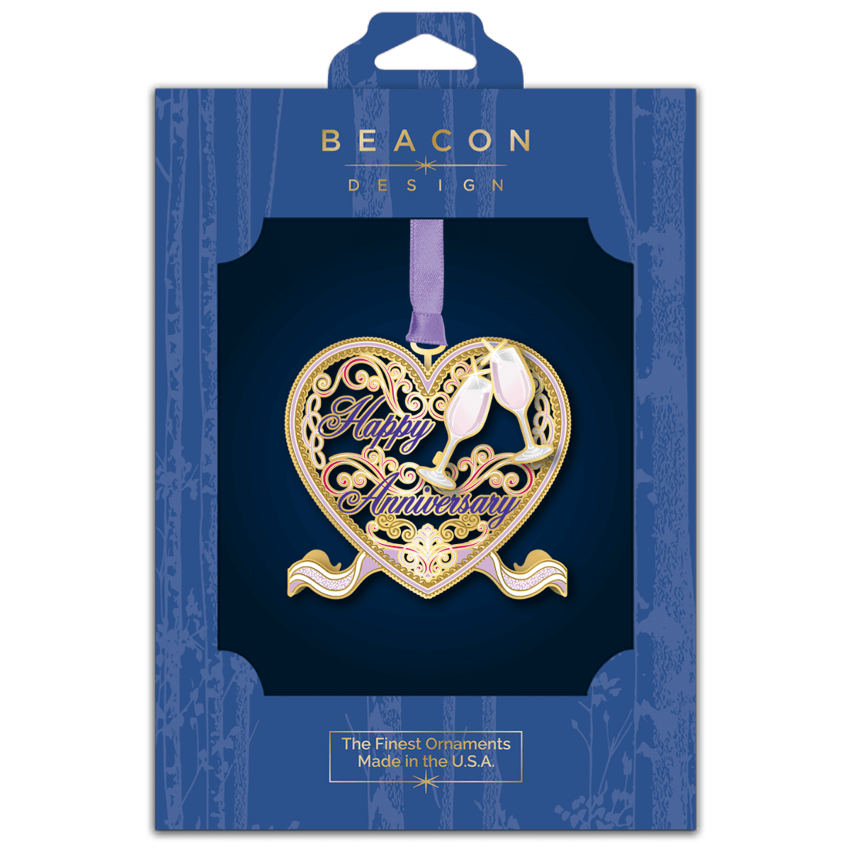 Custom ornament featuring a heart-shaped design with ornate scrollwork, champagne flutes, and the message “Happy Anniversary,” displayed in Beacon Design retail packaging