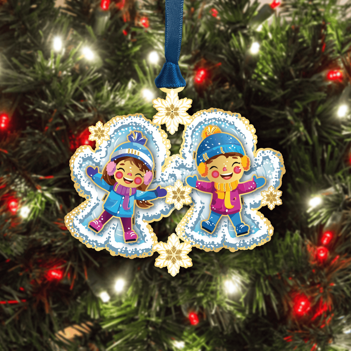 Ornament featuring two children making snow angels surrounded by snowflakes, displayed on a decorated Christmas tree