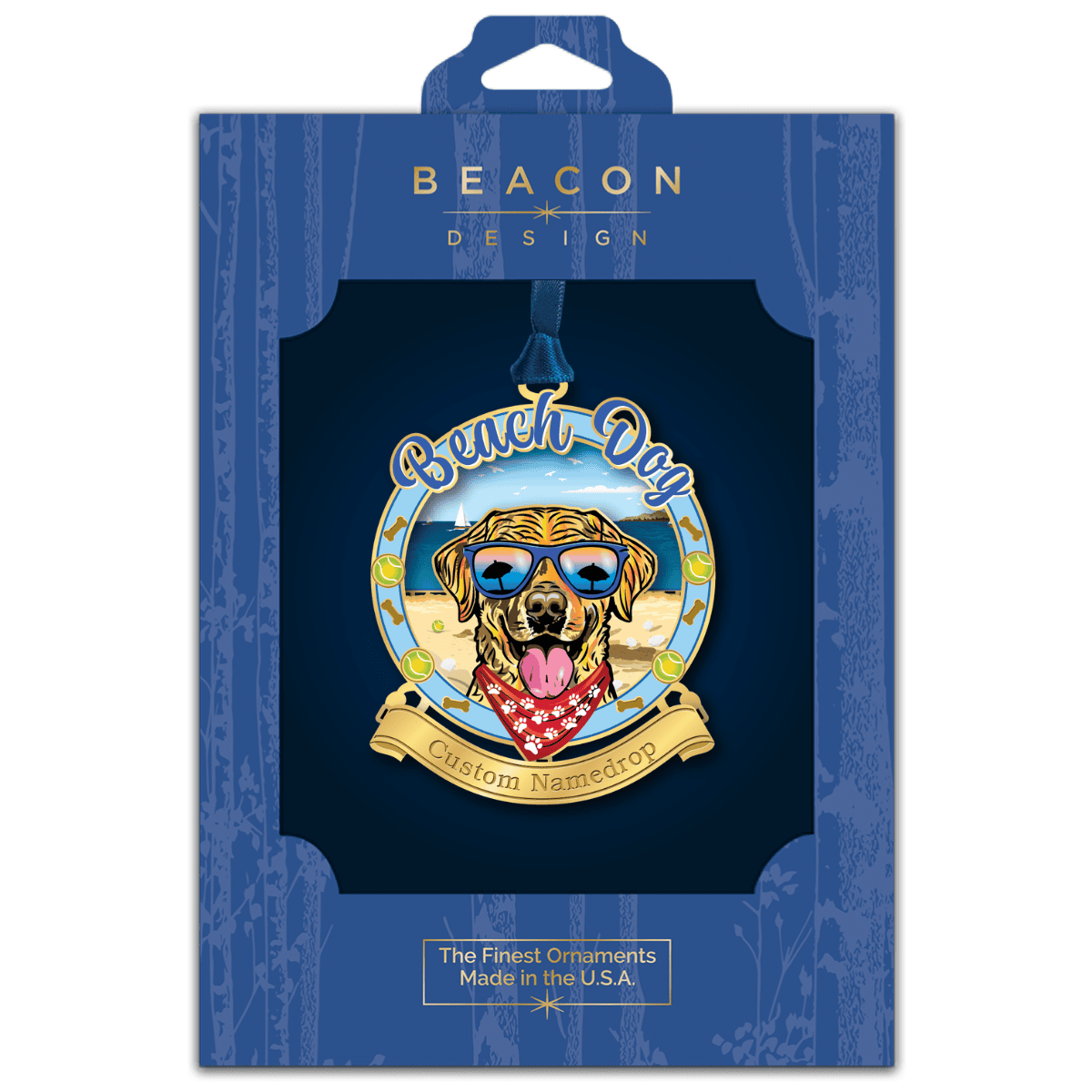 Custom namedrop ornament featuring a golden retriever wearing sunglasses on a beach scene displayed in Beacon Design retail packaging
