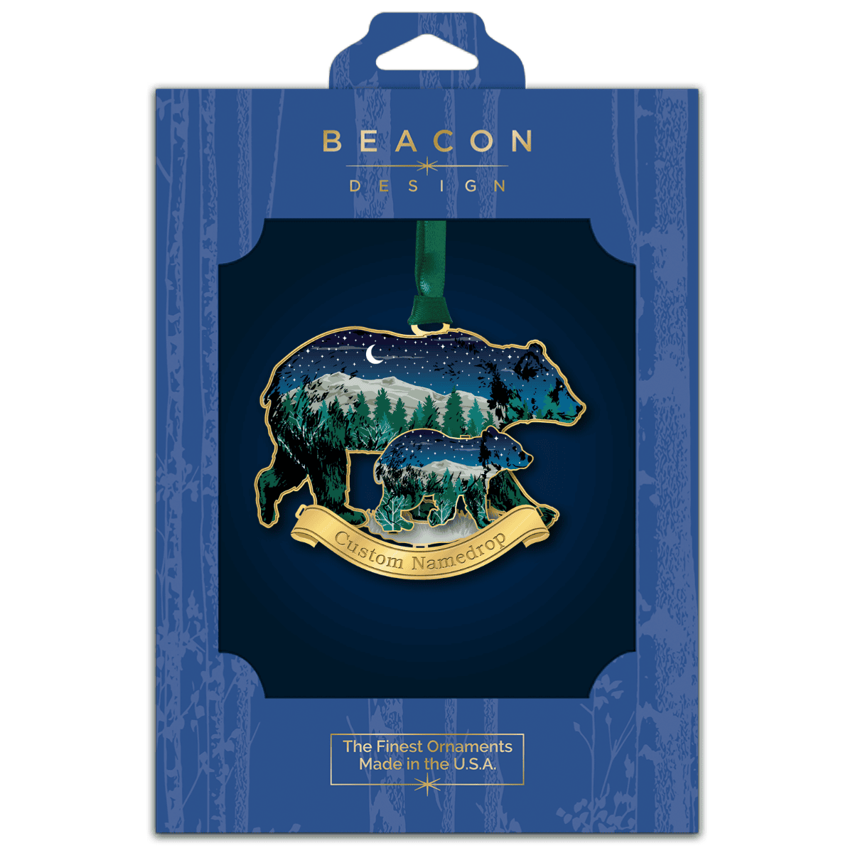 Custom namedrop ornament featuring a bear and cub silhouette with a mountain and forest night scene displayed in Beacon Design retail packaging