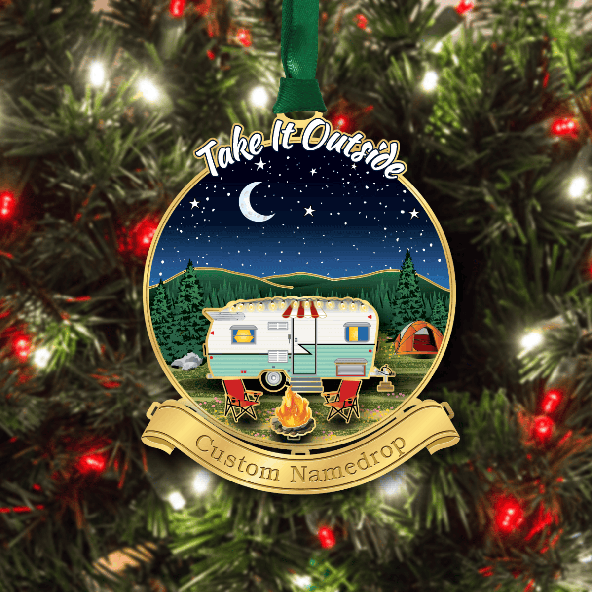 Custom namedrop ornament featuring a vintage camper, campfire, and tent under a starry night sky displayed on a decorated Christmas tree